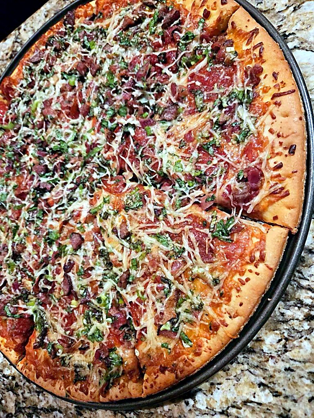 Pizza with mixed cheese and greens
