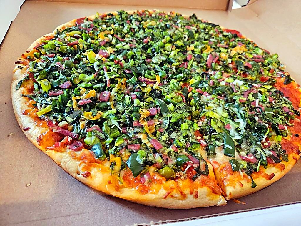 Pizza with arugula and pepperoni